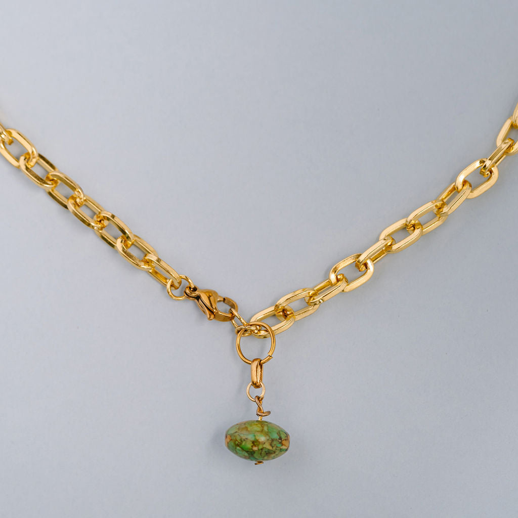 Chunky gold chocker with green stone charm