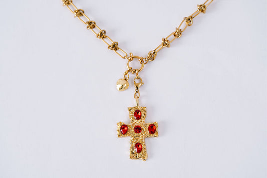 Knotted chain with large red jeweled cross and tiny heart