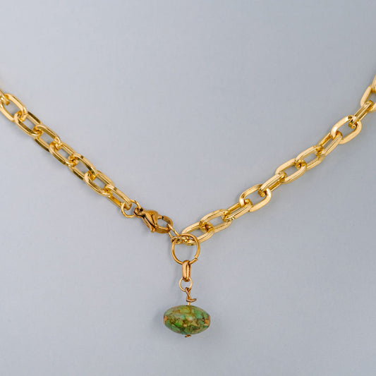 Chunky gold chocker with green stone charm