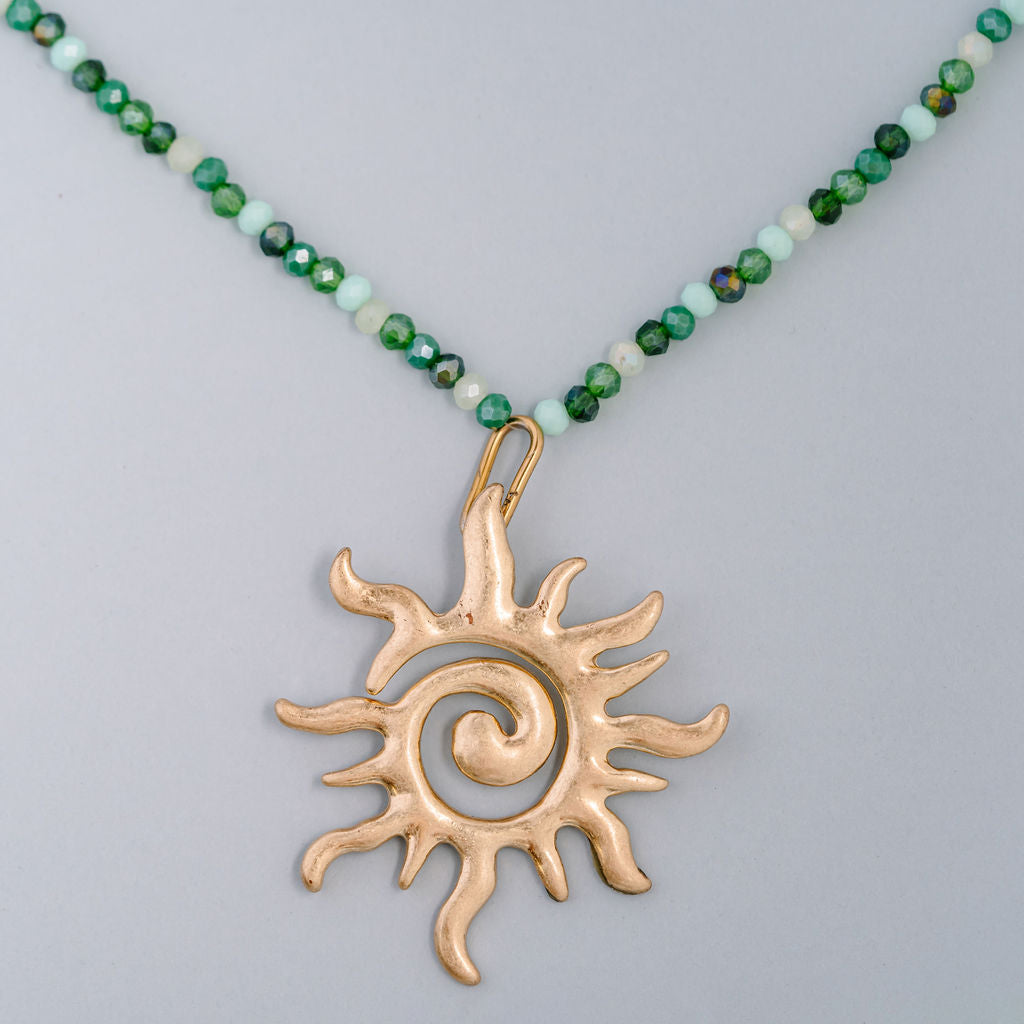 Multi green beaded choker with large swirl sun