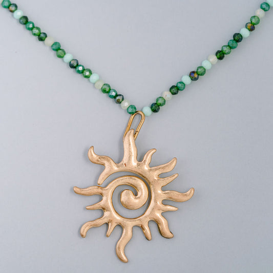 Multi green beaded choker with large swirl sun